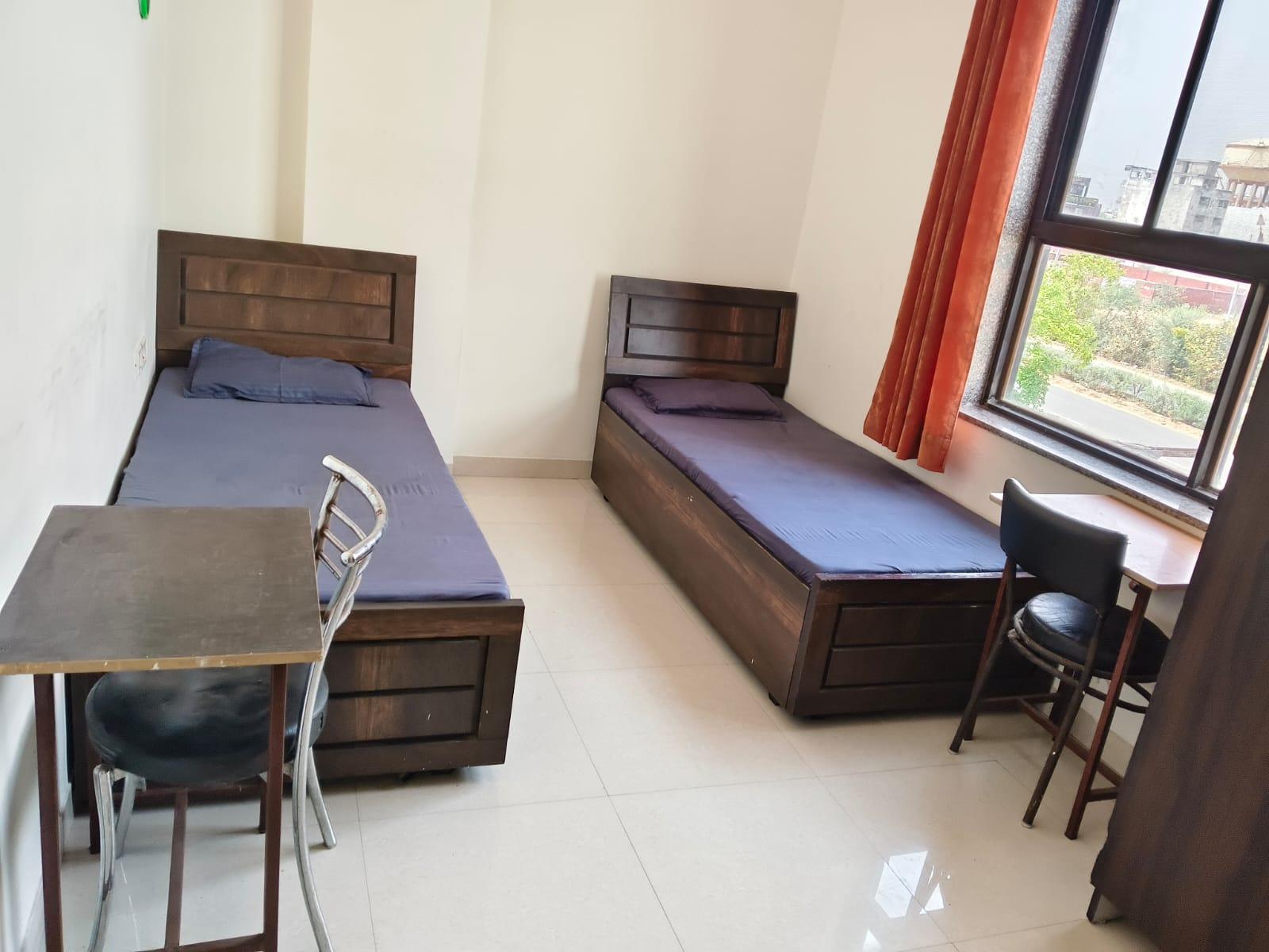 Furnished twin-sharing PG room for boys in Jagatpura, Jaipur